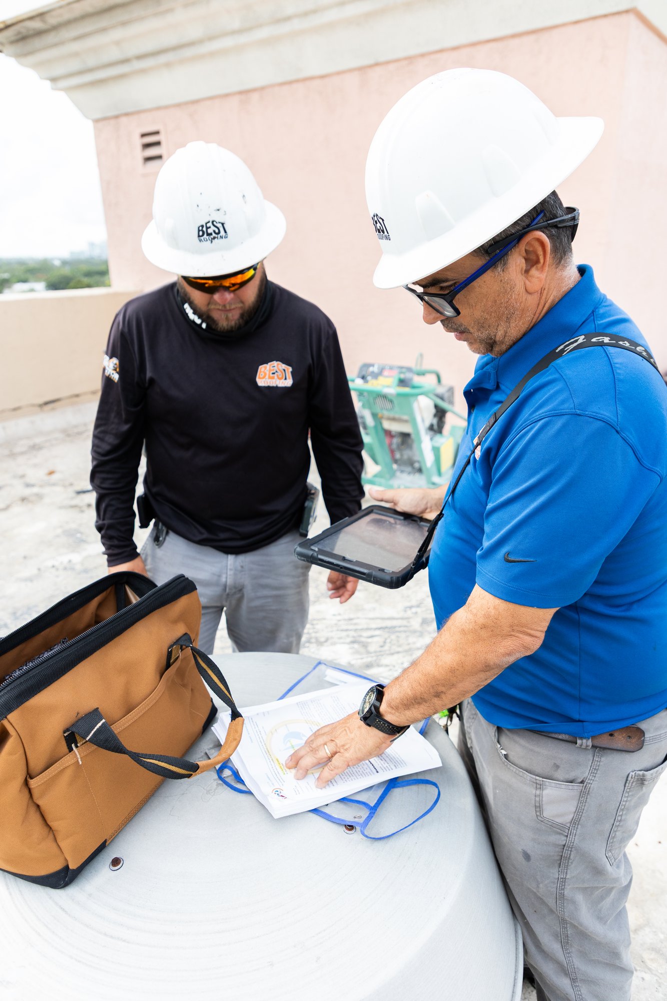 Roofing project managers coordinating on a project