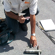 Roofing inspector checking for roof problems